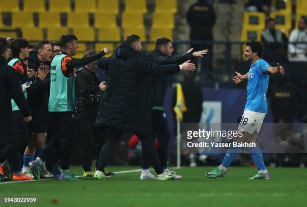 Giovanni Simeone of SSC Napoli celebrates scoring his team's first goal with team staff during the Italian EA Sports FC Supercup semifinal match...