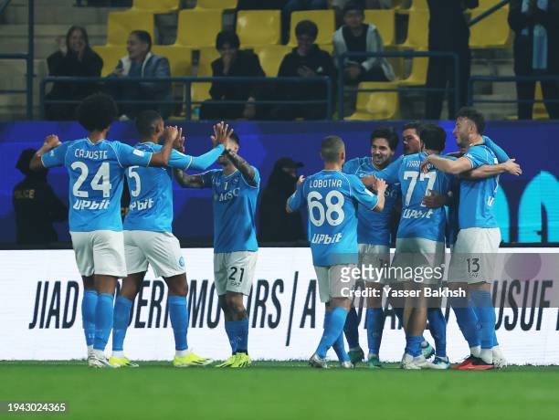 Giovanni Simeone of SSC Napoli celebrates scoring his team's first goal with teammates during the Italian EA Sports FC Supercup semifinal match...