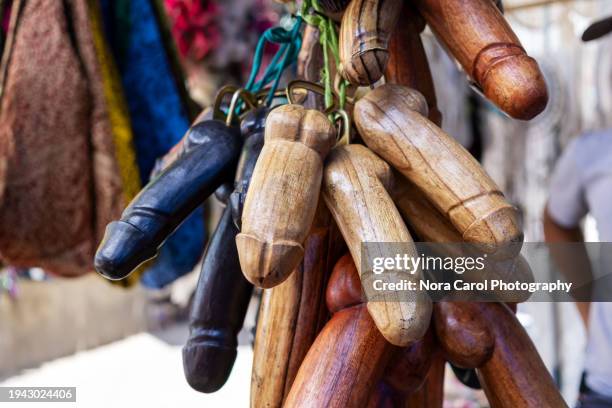 balinese wooden phallic souvenir - souvenir stock pictures, royalty-free photos & images