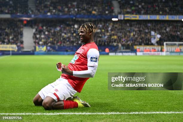 Reims' Ivorian defender Emmanuel Agbadou celebrates after scoring a goal during the French Cup round of 32 football match between FC...