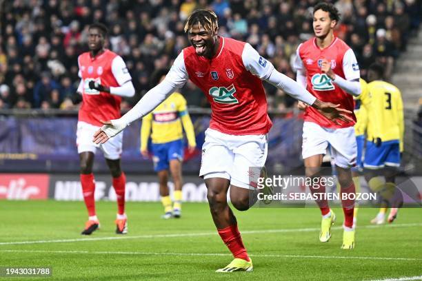Reims' Ivorian defender Emmanuel Agbadou celebrates after scoring a goal during the French Cup round of 32 football match between FC...