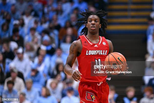 Ty-Laur Johnson of the Louisville Cardinals moves the ball against the North Carolina Tar Heels during the game at the Dean E. Smith Center on...
