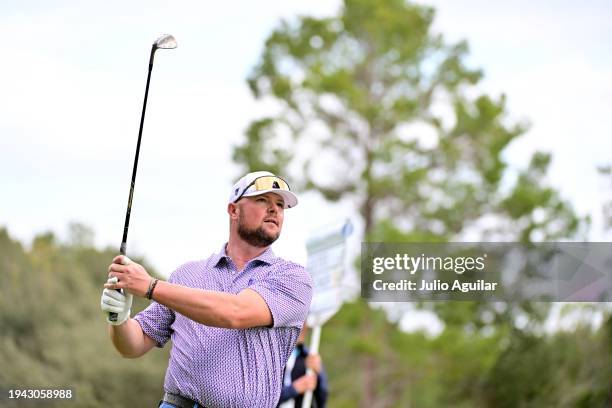 Former baseball pitcher Jon Lester plays a shot on the eighth hole during the first round of the Hilton Grand Vacations Tournament of Champions at...