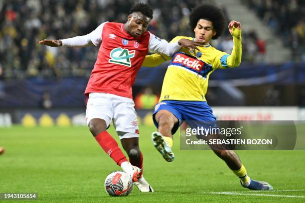 Reims' French defender Mamadou Diakhon fights for the ball with Sochaux's French midfielder Malcolm Viltard during the French Cup round of 32...