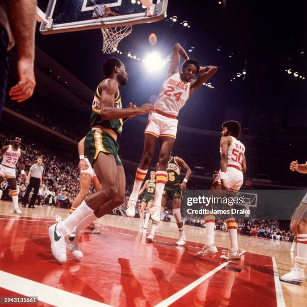 Moses Malone of the Houston Rockets rebounds a shot during a game against the Seattle SuperSonics at The Summit on January 27, 1979 in Houston, Texas.