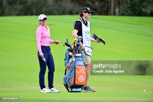 Jodi Ewart Shadoff of England smiles with her caddie on the ninth hole during the first round of the Hilton Grand Vacations Tournament of Champions...
