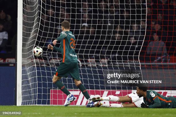 Waalwijk's Dutch forward Michiel Kramer scores his team's first goal during the Dutch Eredivisie match between Ajax Amsterdam and RKC Waalwijk at the...