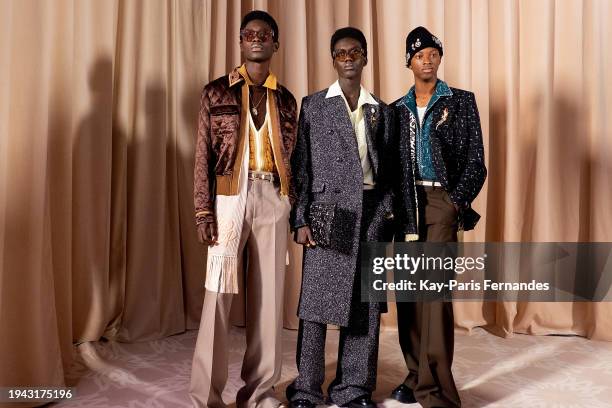 Models Rodney Osei, Mohamed Camara and Nonso Ojukwu pose backstage prior to the Amiri Menswear Fall/Winter 2024-2025 show as part of Paris Fashion...