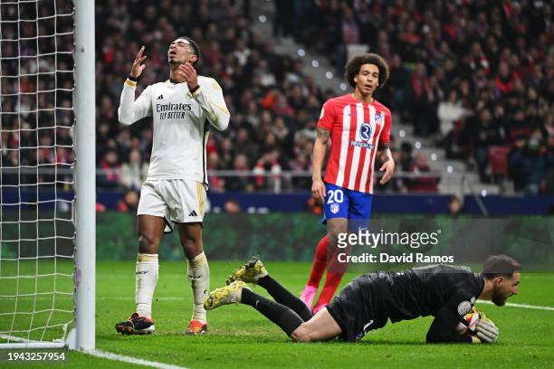 Jude Bellingham of Real Madrid reacts as Jan Oblak of Atletico Madrid saves a shot during the Copa del Rey Round of 16 match between Atletico Madrid...