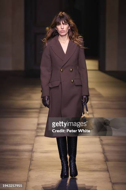 Lou Doillon walks the runway during the AMI - Alexandre Mattiussi Menswear Fall/Winter 2024-2025 show as part of Paris Fashion Week on January 18,...