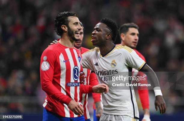 Mario Hermoso of Atletico Madrid and Vinicius Junior of Real Madrid interact during the Copa del Rey Round of 16 match between Atletico Madrid and...
