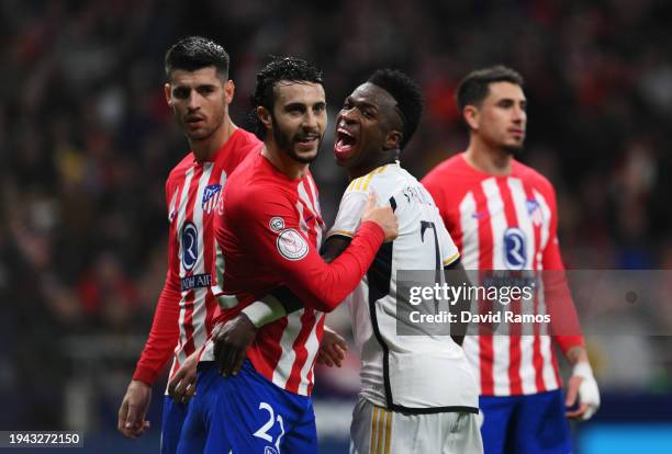 Mario Hermoso of Atletico Madrid and Vinicius Junior of Real Madrid interact during the Copa del Rey Round of 16 match between Atletico Madrid and...