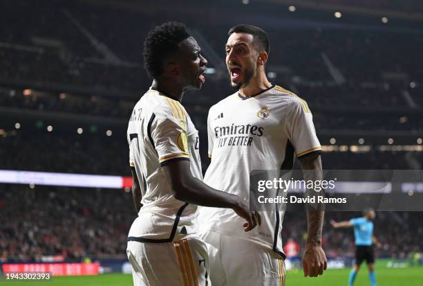 Joselu celebrates scoring his team's second goal with teammate Vinicius Junior during the Copa del Rey Round of 16 match between Atletico Madrid and...