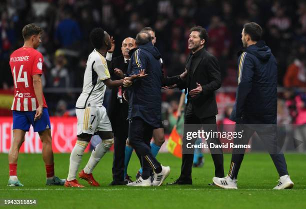 Vinicius Junior of Real Madrid and Diego Simeone, Head Coach of Atletico Madrid, argue during the Copa del Rey Round of 16 match between Atletico...