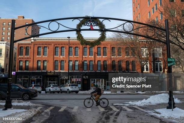 People walk through the quiet streets of downtown Manchester on January 18, 2024 in Manchester, New Hampshire. Republican presidential candidates are...