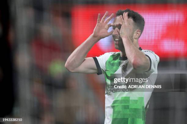 Liverpool's Portuguese striker Diogo Jota celebrates after scoring their second goal during the English Premier League football match between...