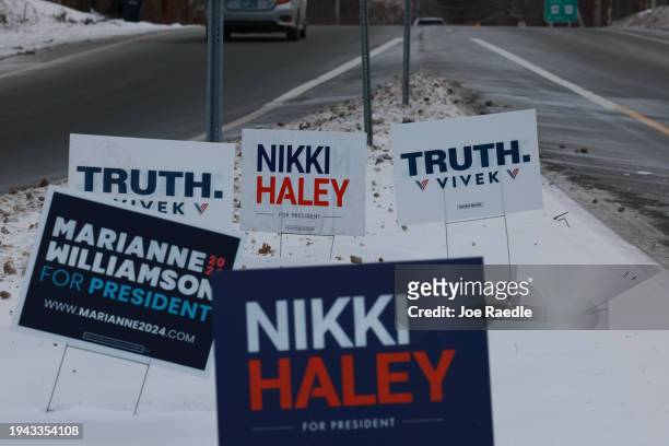 Campaign signs are stuck in the snow on January 18 in Portsmouth, New Hampshire. The state's Republican primary is scheduled for January 23, 2024.