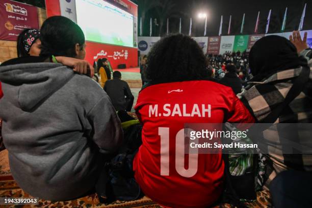 Girl wears a Mohamed Salah T-shirt while watching the Egypt-Ghana match in the African Cup of Nations at the Gezira Youth Center on January 18, 2024...
