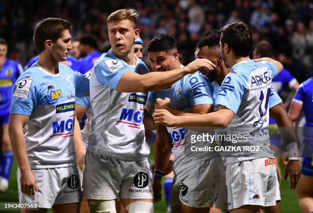Bayonne's players react after scoring the first try during the European Rugby Champions Cup Pool 3 rugby union match between Aviron Bayonnais and...