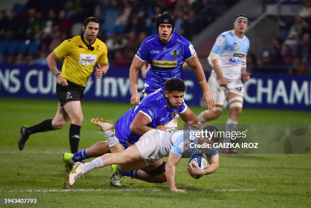 Bayonne's French scrum-half Guillaume Rouet is tackled during the European Rugby Champions Cup Pool 3 rugby union match between Aviron Bayonnais and...