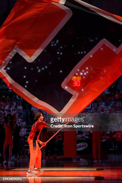 An Illinois Fighting Illini cheerleader waves a flag before the college basketball game between the Rutgers Scarlet Knights and the Illinois Fighting...