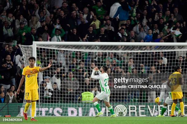 Real Betis' Spanish midfielder Isco celebrates scoring his team's first goal during the Spanish League football match between Real Betis and FC...