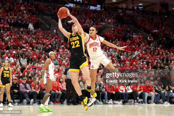 Caitlin Clark of the Iowa Hawkeyes is fouled by Celeste Taylor of the Ohio State Buckeyes during the fourth quarter of the game at Value City Arena...