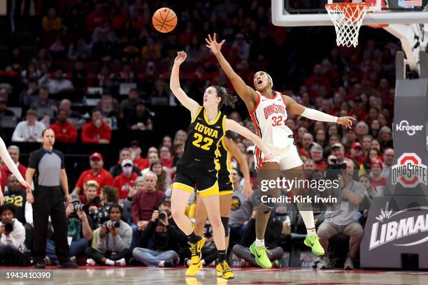 Caitlin Clark of the Iowa Hawkeyes knocks the ball away from Cotie McMahon of the Ohio State Buckeyes during the fourth quarter of the game at Value...