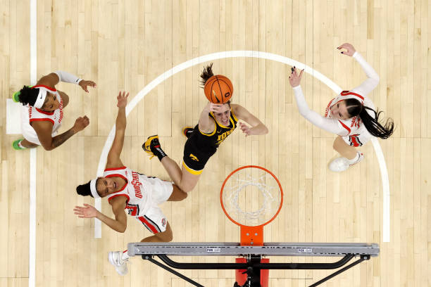 Caitlin Clark of the Iowa Hawkeyes shoots the ball while being defended by Taylor Thierry of the Ohio State Buckeyes during the second quarter of the...
