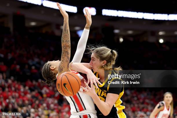 Kate Martin of the Iowa Hawkeyes collides with Rikki Harris of the Ohio State Buckeyes during the third quarter of the game at Value City Arena on...