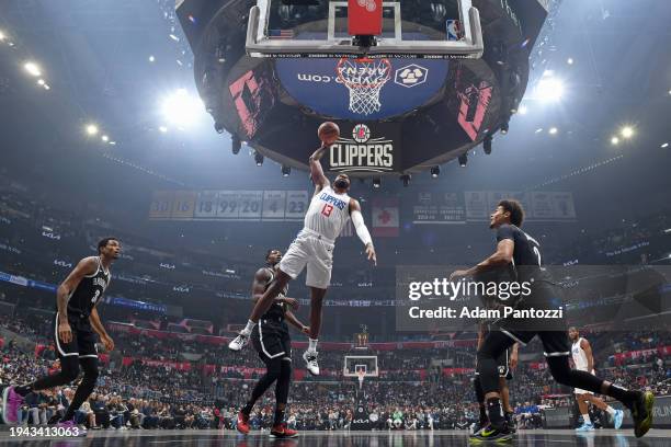 Paul George of the LA Clippers dunks the ball during the game against the Brooklyn Nets on January 21, 2024 at Crypto.Com Arena in Los Angeles,...