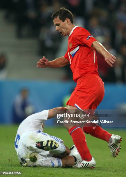 June 14: Konstantin Zyryanov of Russia and Angelos Basinas of Greece challenge during the UEFA Euro 2008 Group D match between Greece and Russia at...