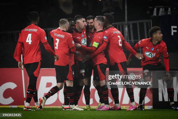 Rennes' French forward Martin Terrier celebrates with teammates after scoring his team's first goal during the French Cup round of 32 football match...