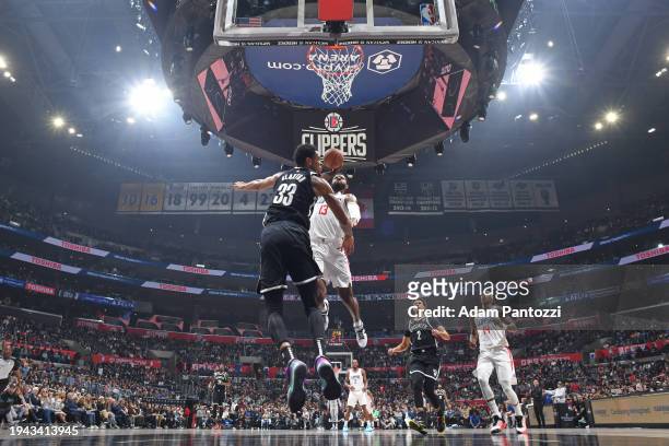 Paul George of the LA Clippers dunks the ball during the game against the Brooklyn Nets on January 21, 2024 at Crypto.Com Arena in Los Angeles,...