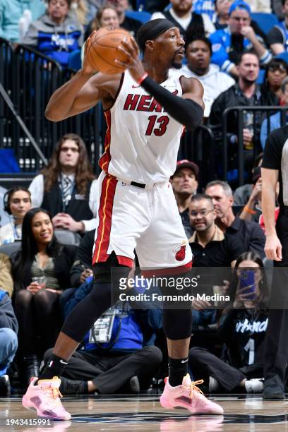 Bam Adebayo of the Miami Heat looks to pass the ball during the game against the Orlando Magic on January 21, 2024 at Amway Center in Orlando,...