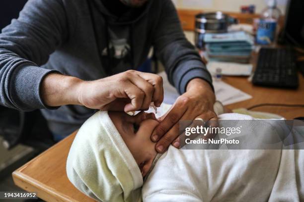 Employee is providing a Polio vaccine in a clinic in Deir al-Balah, central Gaza Strip, on January 21 amid ongoing battles between Israel and the...