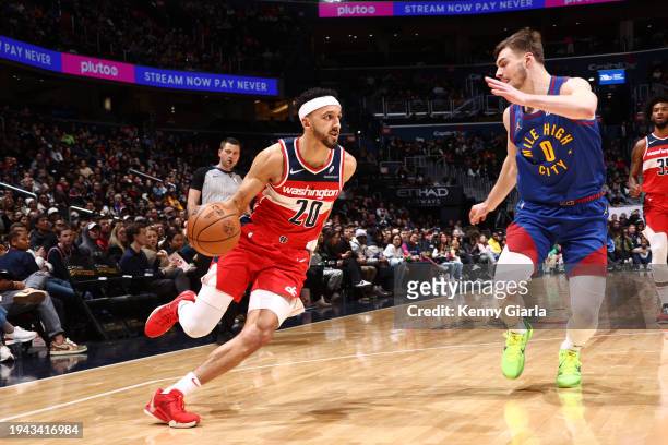 Landry Shamet of the Washington Wizards drives to the basket during the game against the Denver Nuggets on January 21, 2024 at Capital One Arena in...