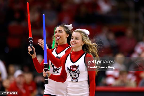 Cheerleaders of the NC State Wolfpack perform during the game against the Virginia Tech Hokies at PNC Arena on January 20, 2024 in Raleigh, North...