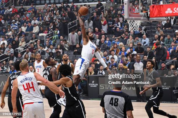 Paul George of the LA Clippers dunks the ball during the game against the Brooklyn Nets on January 21, 2024 at Crypto.Com Arena in Los Angeles,...