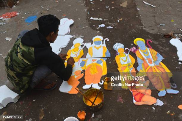 An artist is making a placard of the Hindu lord Ram in Kolkata, India, on January 21, 2024.