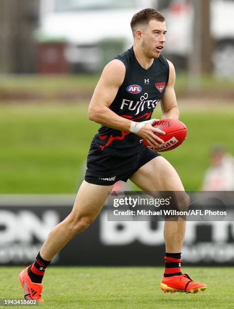 Zach Merrett of the Bombers in action during the Essendon Bombers training session at the NEC Hangar on January 22, 2024 in Melbourne, Australia.