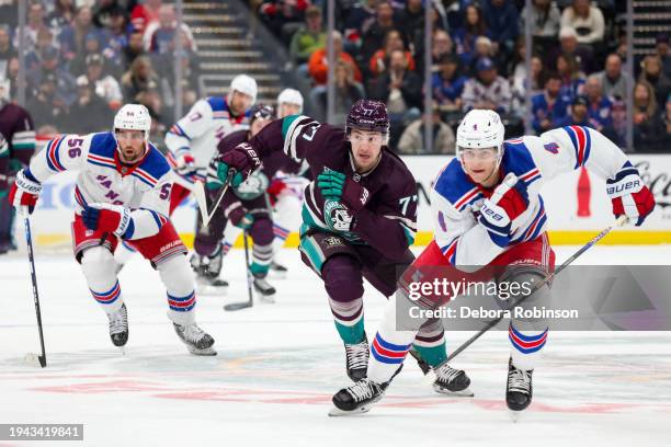 Erik Gustafsson of the New York Rangers, Frank Vatrano of the Anaheim Ducks and Braden Schneider of the New York Rangers battle for position during...