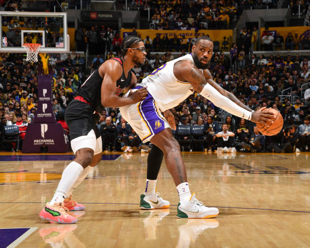 Scoot Henderson of the Portland Trail Blazers plays defense during the game against LeBron James of the Los Angeles Lakers on January 21, 2024 at...