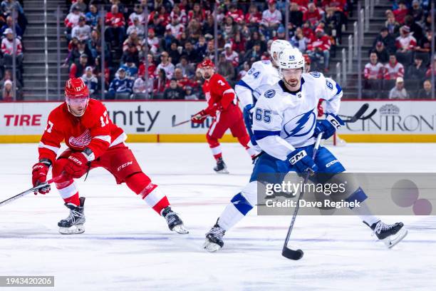 Maxwell Crozier of the Tampa Bay Lightning controls the puck next to Daniel Sprong of the Detroit Red Wings during the first period at Little Caesars...