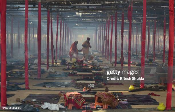 Devotees take part in a religious procession in a camp on the eve of the inauguration of Ram Mandir on January 21, 2024 in Ayodhya, India. The Ram...