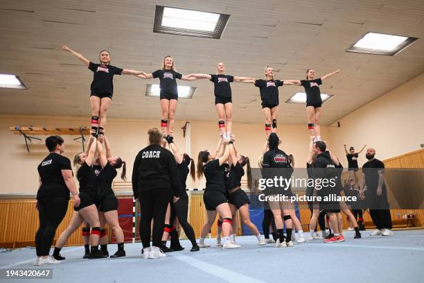 January 2024, Berlin: Team members form a pyramid during a training session of the Fabulous Giants cheerleading team of the Giants Cheerleader club...