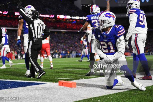 Jordan Poyer of the Buffalo Bills holds his wrist during the second half of the AFC Divisional Playoff game against the Kansas City Chiefs at...
