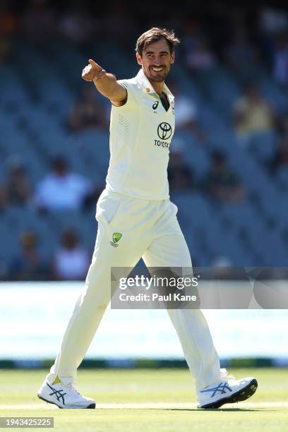 Mitchell Starc of Australia celebrates taking the wicket of Joshua Da Silva of the West Indies during day three of the Mens Test match series between...