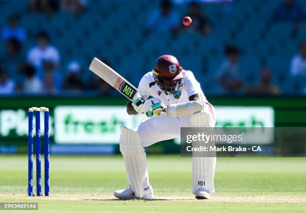 Alzarri Joseph of the West Indies ducks a bouncer from Josh Hazelwood of Australia during day three of the Mens Test match series between Australia...