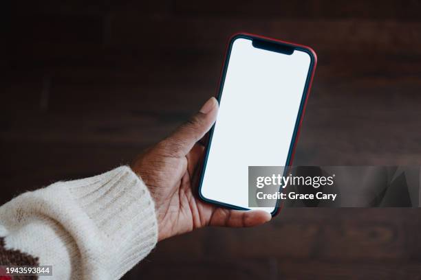 woman holds smart phone with blank screen - iphone text stock pictures, royalty-free photos & images
